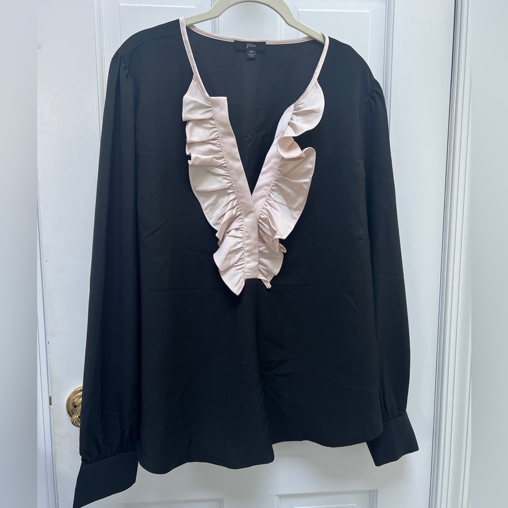 Black top with ruffle detail